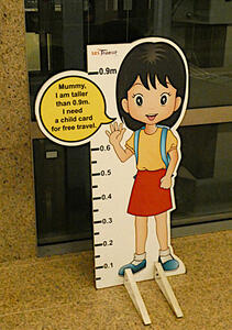 Small poster of child. Text: Mummy, I am taller than 0.9m. I need a child card for free travel.