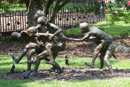 statue of children playing piggyback