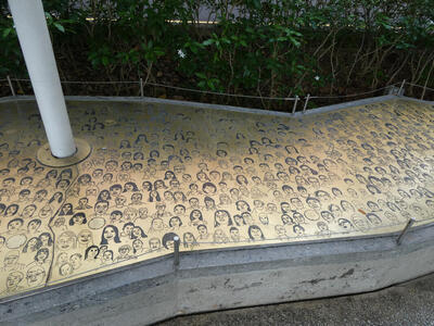 bench with drawings of many people