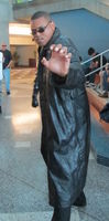Cosplayer dressed as Morpheus from The Matrix