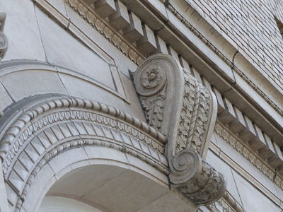 Stone scrollwork on building