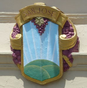 Painted shield with grapes around side; labeled “San Jose”