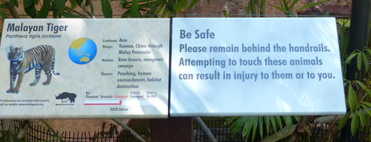 Sign saying “Attempting to touch these animals can result in injury to them or to you.”