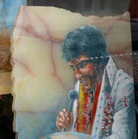 Painting of Elvis on piece of stone