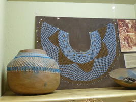 Blue beaded necklace and bowl