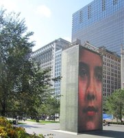Approx. 16m (50 foot) sculpture showing a face on multiple LED screens.
