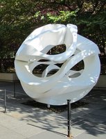 White plastic, twisted spherical-shaped sculpture