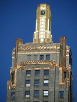 Closeup of gold trim at top of skyscraper