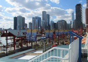 Chicago skyline in background; Navy Pier in foreground.
