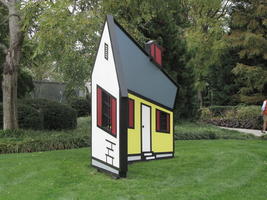 Flat sculpture of house which looks three dimensional in perspective