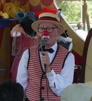 Red-nose clown with straw hat