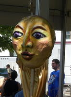 Large mask at puppet-making tent