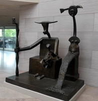 Abstract sculpture of seated man and standing woman