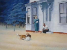 Dog in yard; man and woman in front of house.