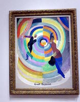 Painting of dancers with colorful circular rings in background