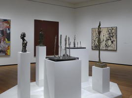 Gallery of Giacometti sculptures; thin, elongated figures