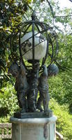 Globe light supported by cherubs