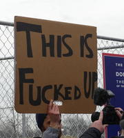 Protest sign: “This is fucked up”
