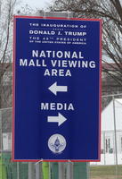 Sign with directions to viewing area and media area.