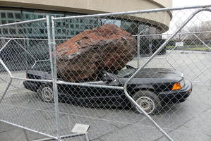 Car smashed by boulder outside Hirshhorn Museum