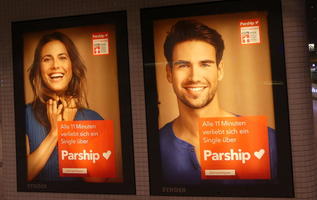 Smiling man and woman in advert