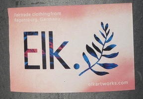 Sticker with Elk dot followed by a a plant stem with leaves rather than .com