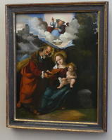 God above with Joseph, Mary, and Jesus (Mary is seated)