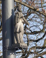 Statue of religiouis figure on lamp post