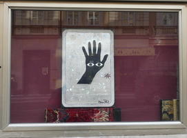 Black hand with two eyes in palm