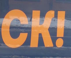 Portion of poster showing text “CK!”