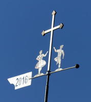 weathervane with man and woman in lederhosen and dirndl, dancing