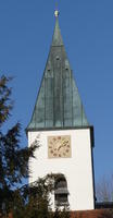 Clock on wall under church steeple