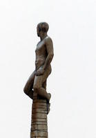 Sculpture of man atop a column