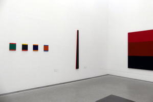 Four small square paintings and a thin trapezoidal painting