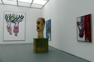 Abstracts surrounding a large distorted bust of a man's head.