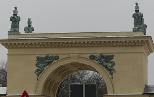 Busts of helmeted figures above arch