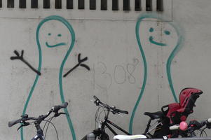 Two stick figure graffitti