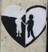 Heart with white person silhouette on black background at left, black silhouette on white background on right.