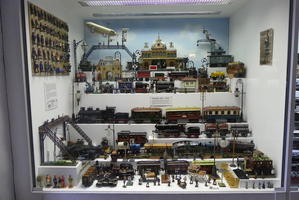 Display case with many toy trains
