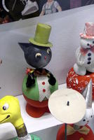 Toy cat wearing green top hat