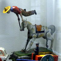 Wind-up toy showing cowboy being bucked off horse