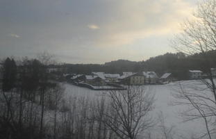 snow-covered buildings in middle distance
