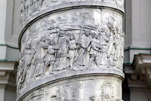 Detail of people in religious procession carved on column