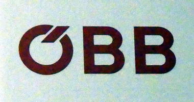 OBB with slash through upper part of O to represent an umlaut
