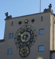 Old clock on outer wall of Deutsches Museum