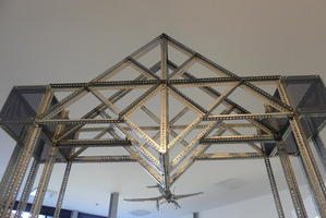 Large arch made of “erector set” pieces