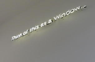 Neon sign on otherwise blank wall: Think of this as a Window...