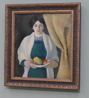 Woman holding plate of fruit