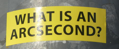 Sticker: “What is an arcsecond?”