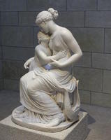 sculpture of mother and child in lap